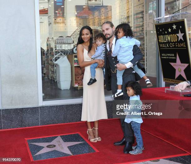 Zoe Saldana, husband Marco Perego, and their children attend Saldana's star ceremony on The Hollywood Walk Of Fame on May 3, 2018 in Hollywood,...