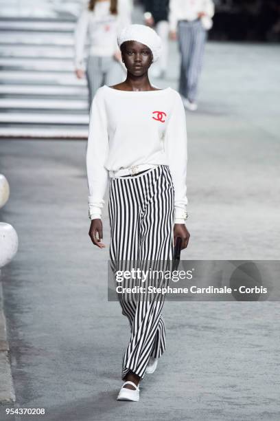 Model walks the runway during the Chanel Cruise 2018/2019 Collection at Le Grand Palais on May 3, 2018 in Paris, France.