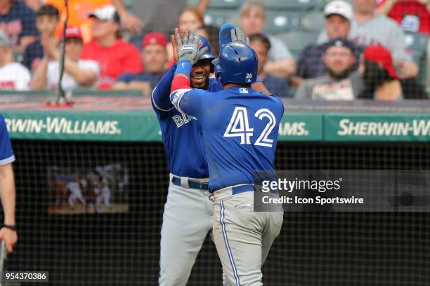 Toronto Blue Jays infielder Yangervis Solarte is congratulated by Toronto Blue Jays outfielder Teoscar Hernandez after hitting a grand slam during...