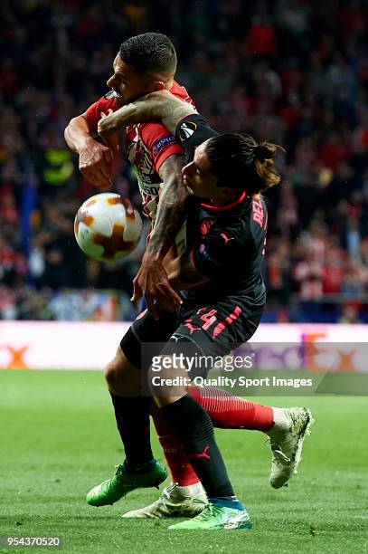 Vitolo of Atletico de Madrid competes for the ball with Hector Bellerin of Arsenal during the UEFA Europa League Semi Final second leg match between...