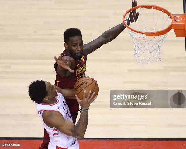 Toronto Raptors guard DeMar DeRozan goes to the hoop against Cleveland Cavaliers forward Jeff Green as the Toronto Raptors play the Cleveland...