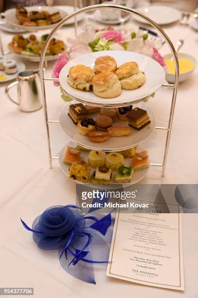 High tea stand, fascinator and menu as seen at Lifetime's afternoon tea in celebration of the premiere of the upcoming movie, "Harry & Meghan: A...