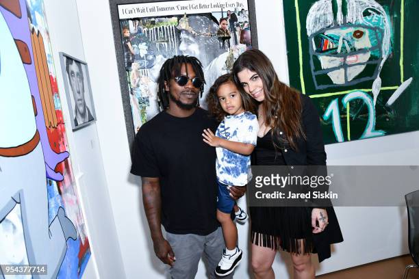 Edwin Baker III and Olivia Namath-Baker attend Art New York on May 3, 2018 at Pier 94 in New York City.