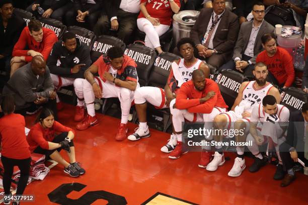 The Raptors starters watch the final minute from the bench as the Toronto Raptors lose game two 128-110 to the Cleveland Cavaliers in the second...