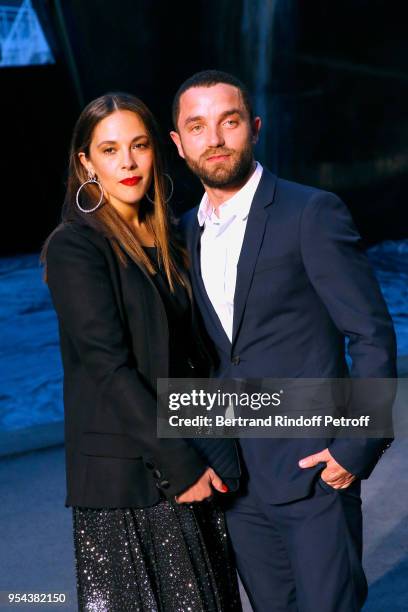 Alysson Paradis and Guillaume Gouix attend the Chanel Cruise 2018/2019 Collection : Photocall, at Le Grand Palais on May 3, 2018 in Paris, France.