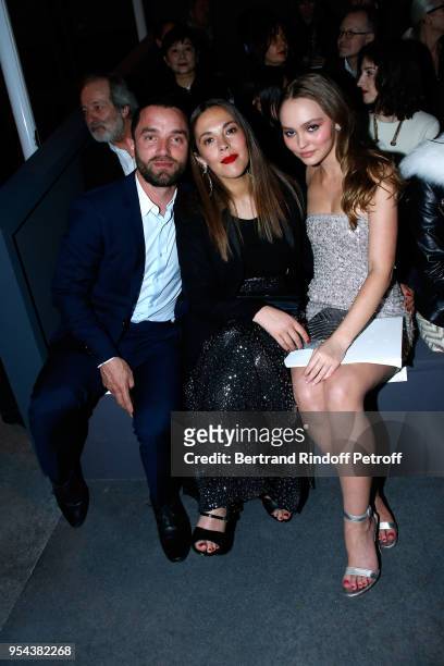 Guillaume Gouix, Alysson Paradis and her niece Lily-Rose Depp attend the Chanel Cruise 2018/2019 Collection : Front Row, at Le Grand Palais on May 3,...