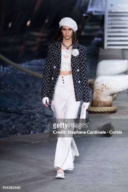 Model walks the runway during the Chanel Cruise 2018/2019 Collection at Le Grand Palais on May 3, 2018 in Paris, France.