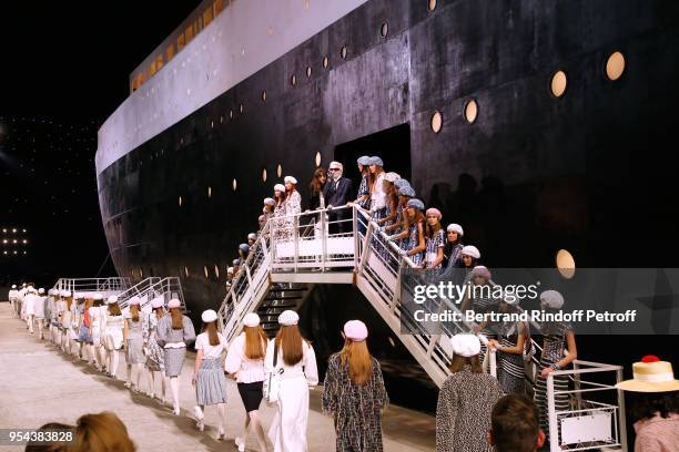 Stylist Karl Lagerfeld, director of Chanel creative studio Virginie Viard and models pose at the end of the Chanel Cruise 2018/2019 Collection at Le...