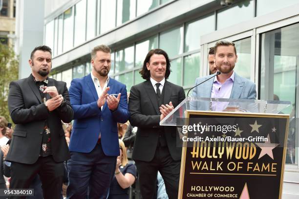 Singers Lance Bass, Chris Kirkpatrick, JC Chasez, Joey Fatone and Justin Timberlake attend the ceremony honoring NSYNC with star on the Hollywood...