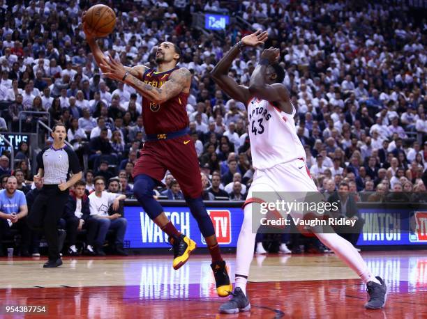 George Hill of the Cleveland Cavaliers goes up for a shot as Pascal Siakam of the Toronto Raptors defends in the second half of Game Two of the...