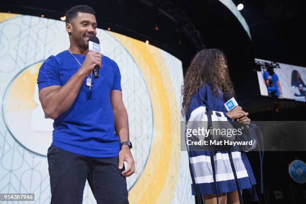 Seattle Seahawks NFL Quarterback Russell Wilson and pop music singer Ciara speaks on stage during WE Day at KeyArena on May 3, 2018 in Seattle,...