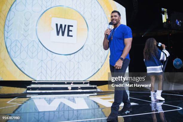 Seattle Seahawks NFL Quarterback Russell Wilson and pop music singer Ciara speaks on stage during WE Day at KeyArena on May 3, 2018 in Seattle,...