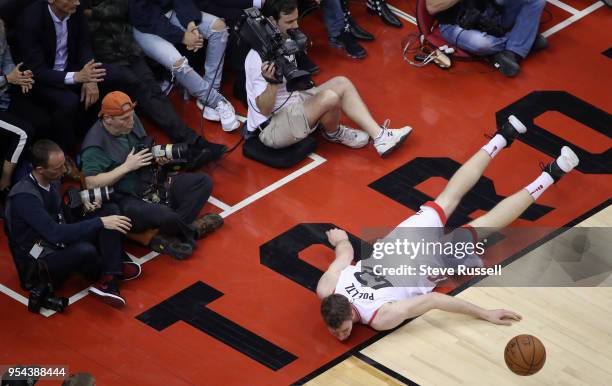 Toronto Raptors center Jakob Poeltl falls to the ground as the Toronto Raptors lose game two 128-110 to the Cleveland Cavaliers in the second round...