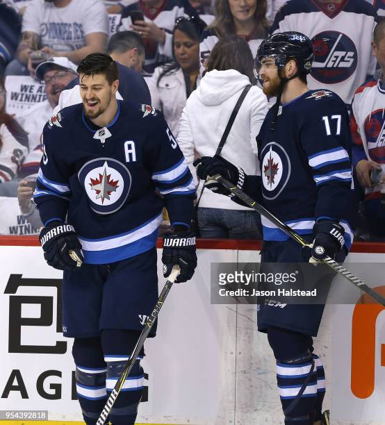 Mark Scheifele and Adam Lowry of the Winnipeg Jets warm up prior to Game Four of the Western Conference Second Round during the 2018 NHL Stanley Cup...