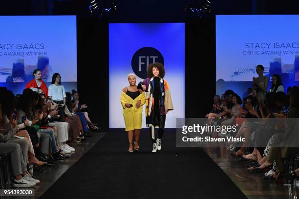 Critic Award winner Stacey Isaacs walks the runway with a model during the 2018 Future Of Fashion Runway Show at The Fashion Institute of Technology...