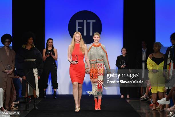 Critic Award winner Charlotte Sasko walks the runway with a model during the 2018 Future Of Fashion Runway Show at The Fashion Institute of...