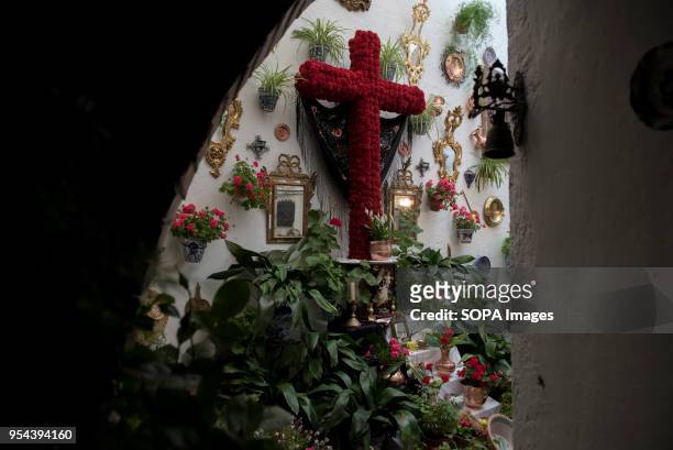 An altar with a decorated cross in the terrace of Carmelitas Descalzas convent the day before Dia de la Cdruz or El día de la Cruz. Día de las Cruces...