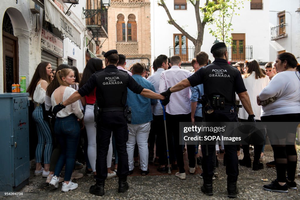 Policemen try to empty Plaza Larga Square of people during...