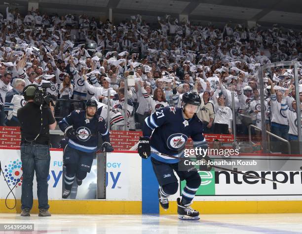 Nikolaj Ehlers and Ben Chiarot of the Winnipeg Jets hit the ice prior to puck drop against the Nashville Predators in Game Four of the Western...