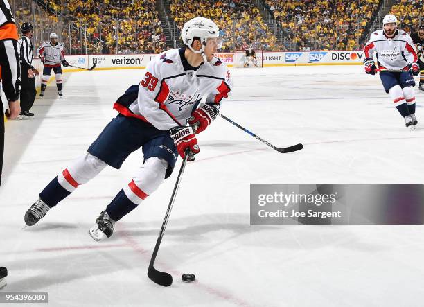 Alex Chiasson of the Washington Capitals handles the puck against the Pittsburgh Penguins in Game Four of the Eastern Conference Second Round during...