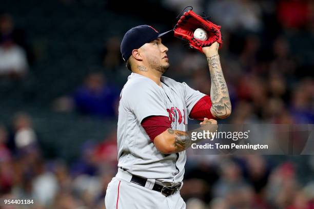 Hector Velazquez of the Boston Red Sox reacts after allowing a run on a wild pitch against the Boston Red Sox in the bottom of the fourth inning at...