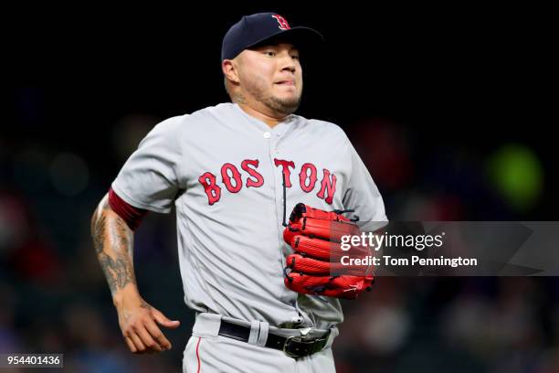 Hector Velazquez of the Boston Red Sox reacts after giving up a three run home run against the Texas Rangers in the bottom of the fourth inning at...