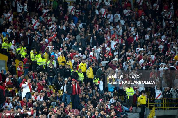 Argentina's River Plate supporters cheer for their team during the Copa Libertadores football match against Colombia's Independiente Santa Fe at...