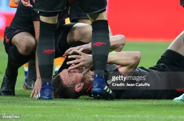 Laurent Koscielny of Arsenal is seriously injured during the UEFA Europa League Semi Final second leg match between Atletico Madrid and Arsenal FC at...