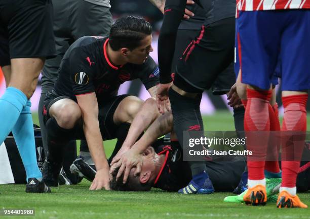 Laurent Koscielny of Arsenal, here recomforted by Granit Xhaka of Arsenal, is seriously injured during the UEFA Europa League Semi Final second leg...