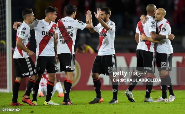 Argentina's River Plate players celebrate at the end of their match against Colombia's Independiente Santa Fe during the Copa Libertadores football...