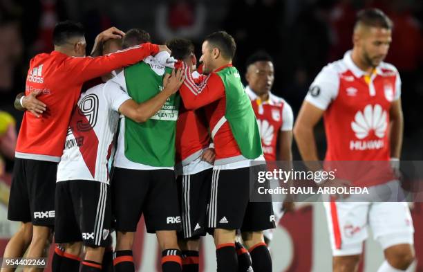 Argentina's River Plate players celebrate at the end of their match against Colombia's Independiente Santa Fe during the Copa Libertadores football...