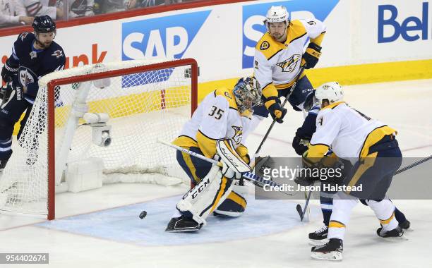 Pekka Rinne of the Nashville Predators makes a save off Bryan Little of the Winnipeg Jets in Game Four of the Western Conference Second Round during...