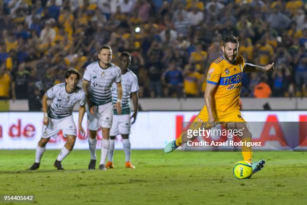 Andre-Pierre Gignac of Tigres kicks a penalty and scores his team's second goal via penalty during the quarter finals first leg match between Tigres...