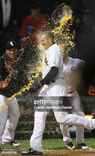 Trayce Thompson of the Chicago White Sox is doused by teammates after hitting a walk-off, solo home run with two out in the bottom of the 9th inning...