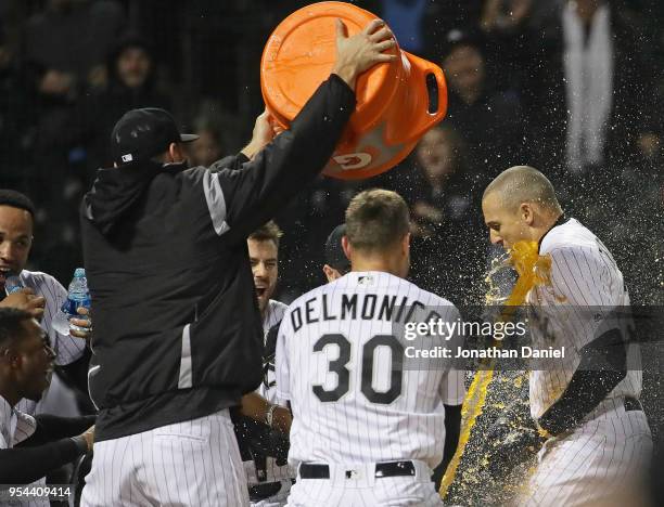 Trayce Thompson of the Chicago White Sox is doused by teammates after hitting a walk-off, solo home run with two out in the bottom of the 9th inning...