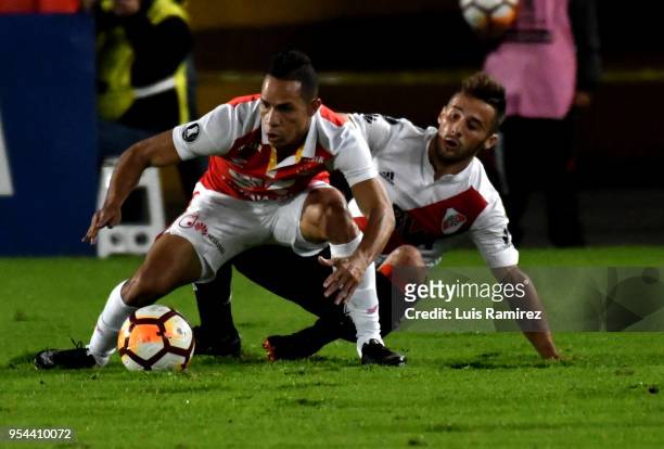 Anderson Plata of Santa Fe vies for the ball with Marcelo Saracchi of River Plate during a group stage match between Independiente Santa Fe and River...