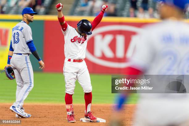 Francisco Lindor of the Cleveland Indians celebrates after hitting an RBI double during the fifth inning against the Toronto Blue Jays in game two of...