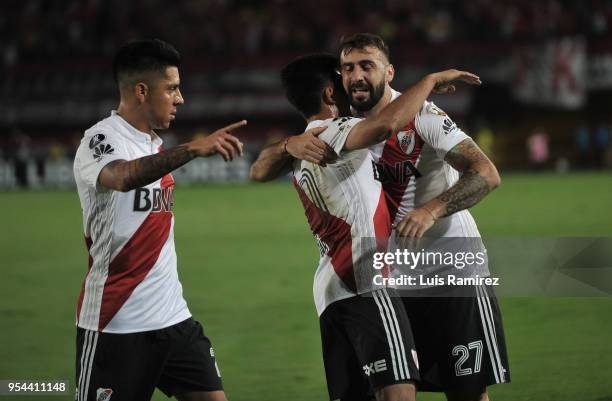 Lucas Pratto of River Plate celebrates with teammates Gonzalo Martinez and Jonatan Maidana after scoring the first goal of his team during a group...