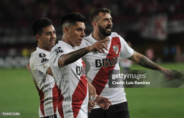 Lucas Pratto of River Plate celebrates with teammates Gonzalo Martinez and Enzo Perez after scoring the first goal of his team during a group stage...