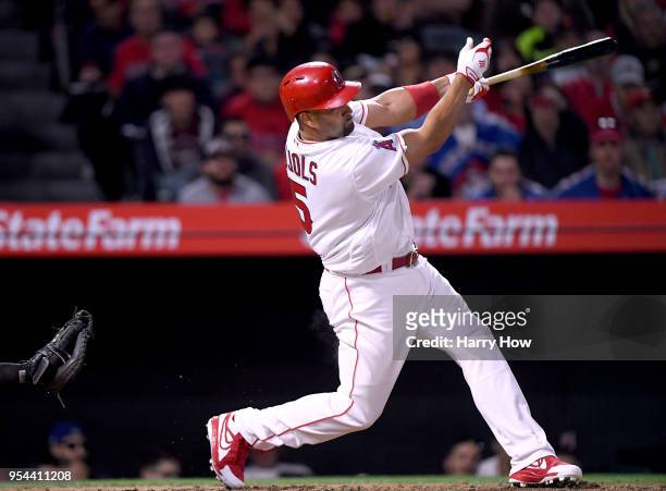Albert Pujols of the Los Angeles Angels hits a double for his 2999th career hit during the second inning against the Baltimore Orioles at Angel...