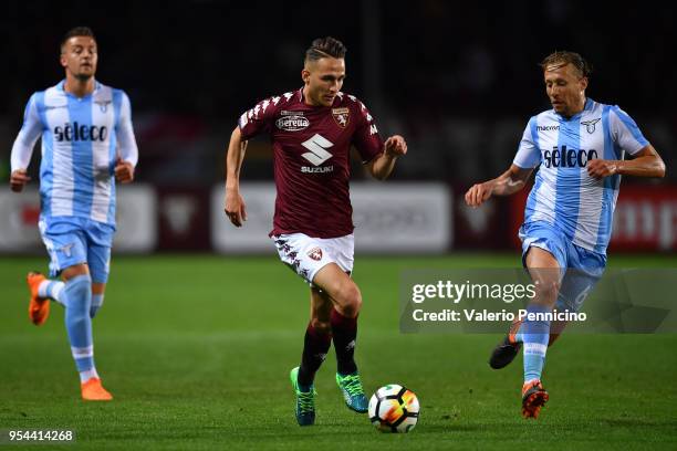 Simone Edera of Torino FC in action against Lucas Leiva Pezzini of SS Lazio during the Serie A match between Torino FC and SS Lazio at Stadio...