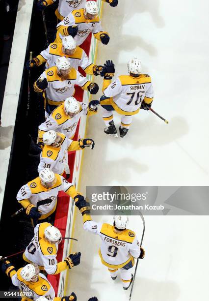 Subban and Filip Forsberg of the Nashville Predators celebrate a second period goal against the Winnipeg Jets with teammates at the bench in Game...