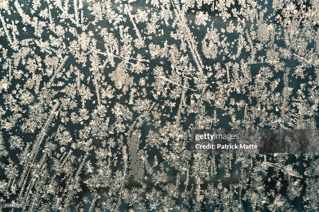 Frosted window with ice patterns