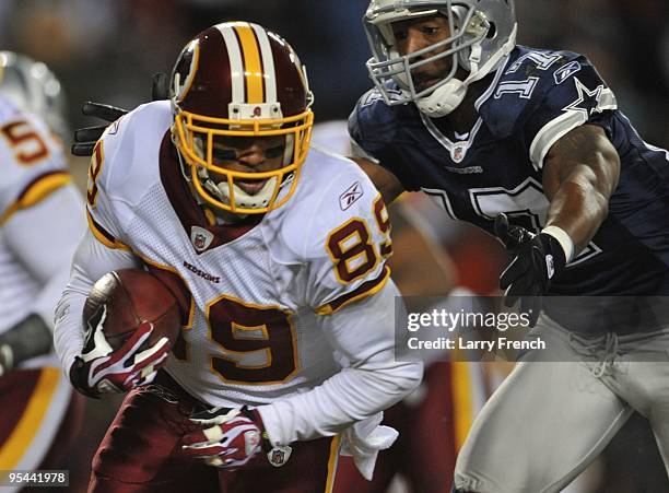 Wide receiver Santana Moss of the Washington Redskins runs with the ball after a catch against the Dallas Cowboys at FedEx Field on December 27, 2009...