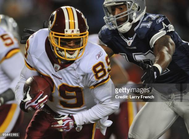 Wide receiver Santana Moss of the Washington Redskins runs with the ball after a catch against the Dallas Cowboys at FedEx Field on December 27, 2009...
