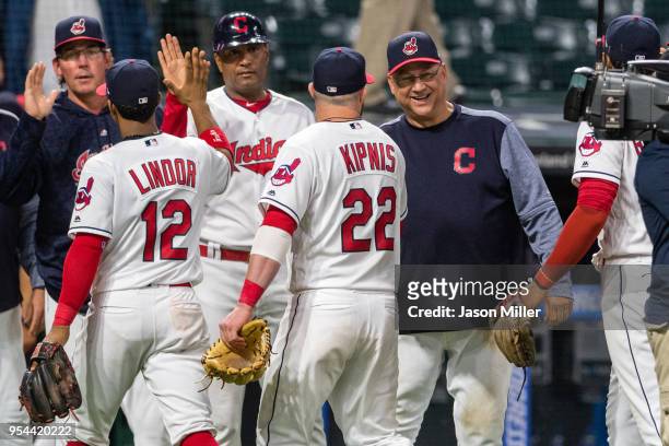 Jason Kipnis of the Cleveland Indians celebrates with manager manager Terry Francona after the Indians defeated the Toronto Blue Jays in game two of...