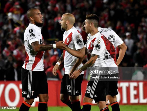 Jonatan Maidana, Javier Pinola and Gonzalo Montiel of River Plate celebrate after a group stage match between Independiente Santa Fe and River Plate...