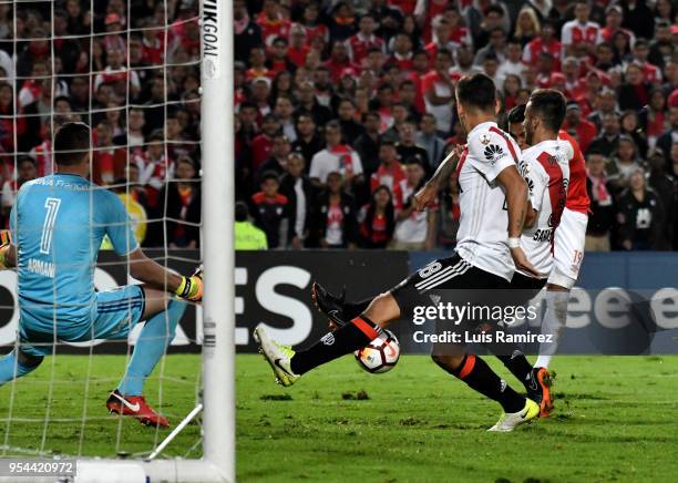 Wilson Morelo of Santa Fe kicks the ball in front of Lucas Martinez Quarta, Marcelo Saracchi and Franco Armani of River Plate during a group stage...