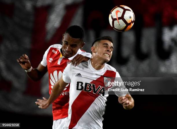 William Tesillo of Santa Fe vies for the ball with Rafael Borre of River Plate during a group stage match between Independiente Santa Fe and River...