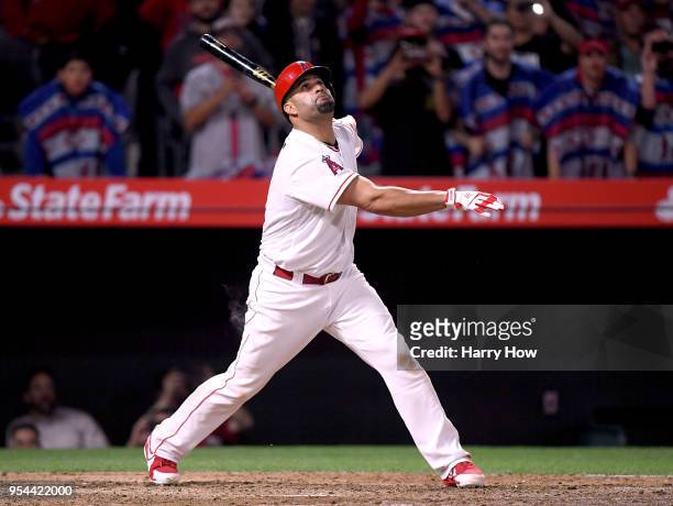 Albert Pujols of the Los Angeles Angels watches his pop fly out with 2999 career hits, during the sixth inning against the Baltimore Orioles at Angel...